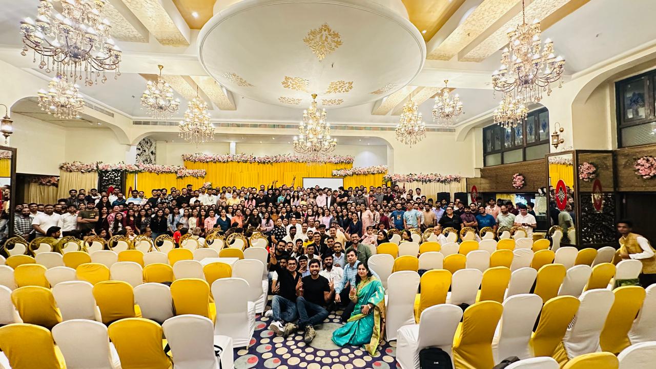 Photo of many employees gathered on stage.