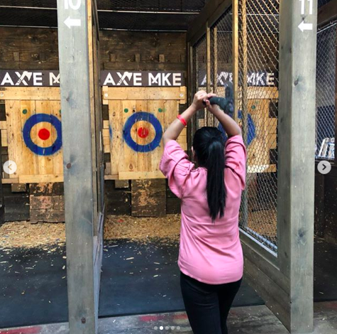 Photo of person axe throwing.